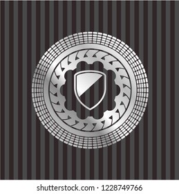 armor icon inside silvery emblem