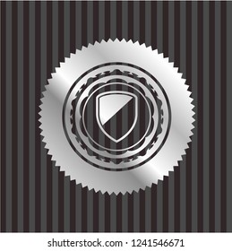 armor icon inside silvery emblem or badge