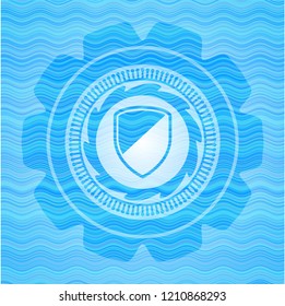 armor icon inside sky blue water wave badge.