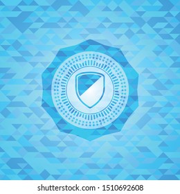 armor icon inside sky blue emblem with triangle mosaic background