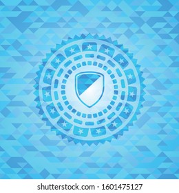 armor icon inside sky blue emblem with mosaic background
