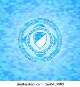 armor icon inside sky blue emblem with triangle mosaic background