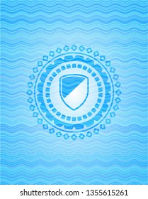 armor icon inside water wave concept badge.