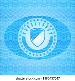 armor icon inside water wave badge.