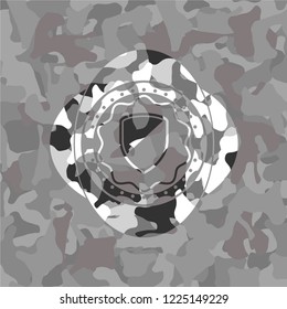 armor icon on grey camouflaged texture