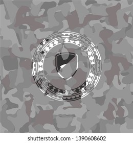 armor icon on grey camouflaged pattern