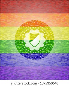 armor icon on mosaic background with the colors of the LGBT flag