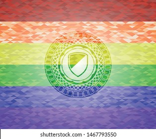 armor icon on mosaic background with the colors of the LGBT flag