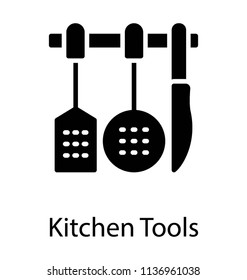 An arranged set of kitchen utensils in a row depicting cutlery 