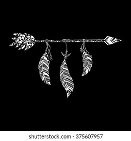 Arrow in ethnic pattern with feathers 