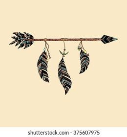 Arrow in ethnic pattern with feathers 