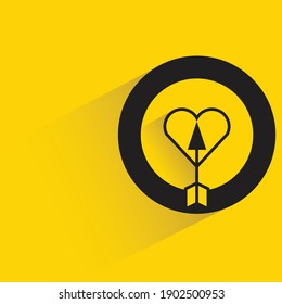 arrow and heart, dart with shadow on yellow background