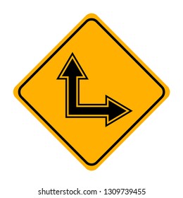 arrow road sign in yellow signage