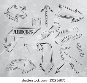 Arrow stylized drawing with coal on grey background.