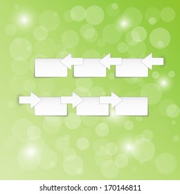 arrows and blank paper blocks on green background with shining balls