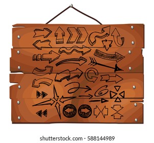 Arrows set on wooden plank background. Freehand drawn. Vector illustration.