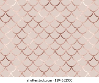 Art deco seamless pattern with rose gold mermaid scales.