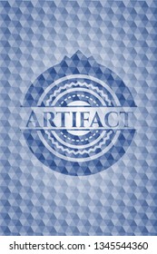 Artifact blue emblem with geometric pattern background.