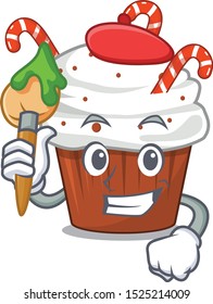 Artist christmas cupcake isolated with the mascot