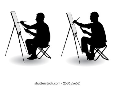 The artist sitting at his easel and paints paints on canvas 