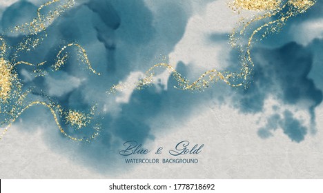 Artistic abstract painting with gold glitter on a background of white watercolor textured paper