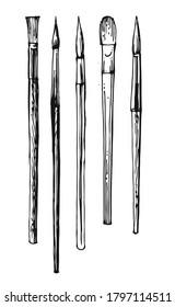 Artistic brushes. Set. Outline hand drawing. Isolated vector object on white background. A sketch with a felt-tip pen, ink on paper.