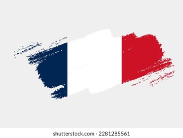 Artistic grunge brush flag of France isolated on white background. Elegant texture of national country flag