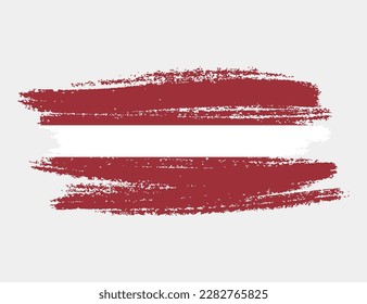 Artistic grunge brush flag of Latvia isolated on white background. Elegant texture of national country flag
