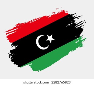 Artistic grunge brush flag of Libya isolated on white background. Elegant texture of national country flag