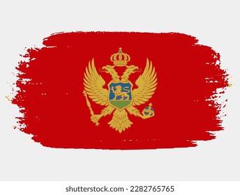 Artistic grunge brush flag of Montenegro isolated on white background. Elegant texture of national country flag