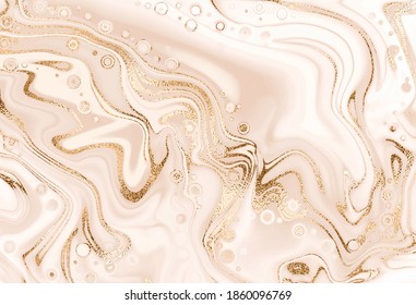 Artistic liquid marble painting background with gold glitter splash.