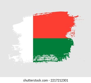 Artistic Madagascar national flag design on painted brush concept