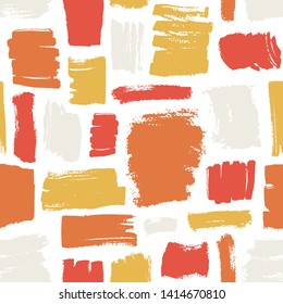 Artistic seamless pattern with red, orange, yellow brush strokes on white background. Creative backdrop with rough paint traces or marks. Decorative vector illustration in contemporary art style.