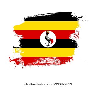 Artistic Uganda national flag design on painted brush concept
