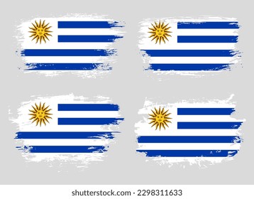 Artistic Uruguay country brush flag collection. Set of grunge brush flags on a solid background