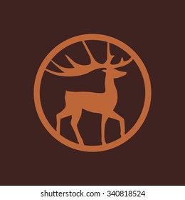 Artistic vector silhouette of a deer brown color. Vector icon.
