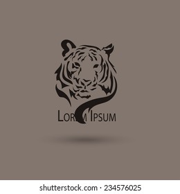 Artistic vector silhouette face tiger. Creative idea of a wild animal icon.