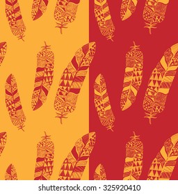 Artistically drawn, stylized, vector set of feathers  on a yellow and red background. Feathers repeating pattern. 