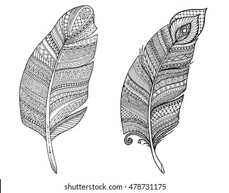 Artistically drawn, stylized, vector set of feathers on a white background. Vintage tribal feathers. Series of doodle feather.