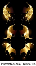 artistically painted, golden dragon wings on a black background.