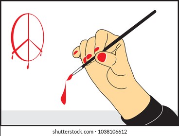 The artist's hand with a brush draws