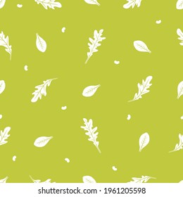 Arugula and spinach seamless vector pattern. White silhouettes on a green background.
