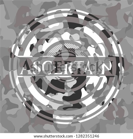 Ascertain on grey camouflage texture