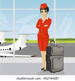 asian air hostess posing with luggage in front of an airport observation deck