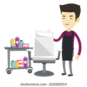 Asian barber standing near armchair and table with cosmetics in barber shop. Professional barber standing at workplace in barber shop. Vector flat design illustration isolated on white background.