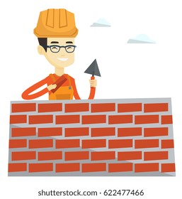 Asian bricklayer in uniform and hard hat. Bicklayer working with spatula and brick on construction site. Bicklayer building brick wall. Vector flat design illustration isolated on white background.