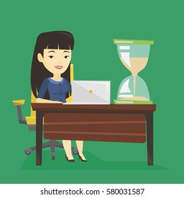 Asian business woman sitting at the table with hourglass symbolizing deadline. Happy business woman coping with deadline successfully. Deadline concept. Vector flat design illustration. Square layout.