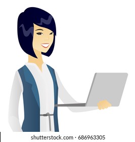 Asian business woman using a laptop. Young smiling business woman working on a laptop. Cheerful business woman holding a laptop. Vector flat design illustration isolated on white background.