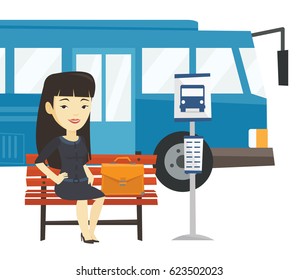 Asian business woman waiting at the bus stop. Young business woman sitting at the bus stop. Business woman sitting on a bus stop bench. Vector flat design illustration isolated on white background.