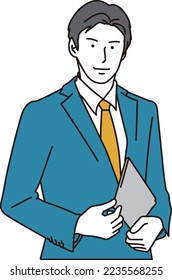 Asian businessman standing with a smile